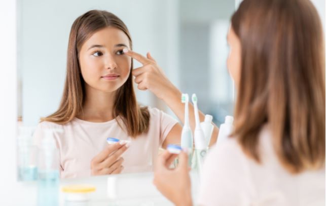 Young girl wearing ortho-k contact lenses to control her myopia