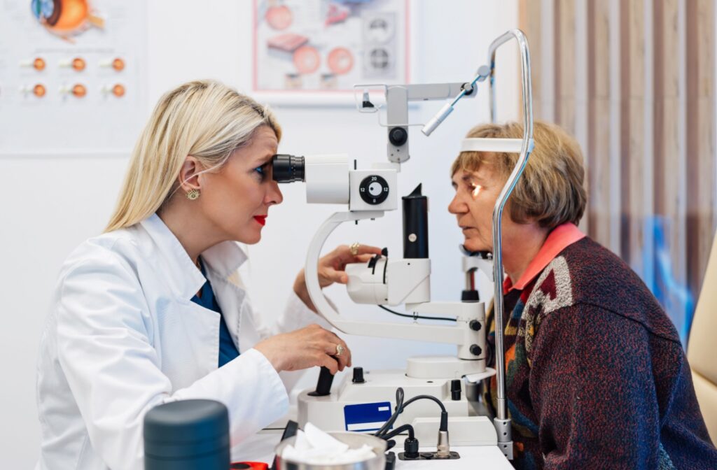 A senior person gets an eye slit test done at the eye doctors during a comprehensive eye exam