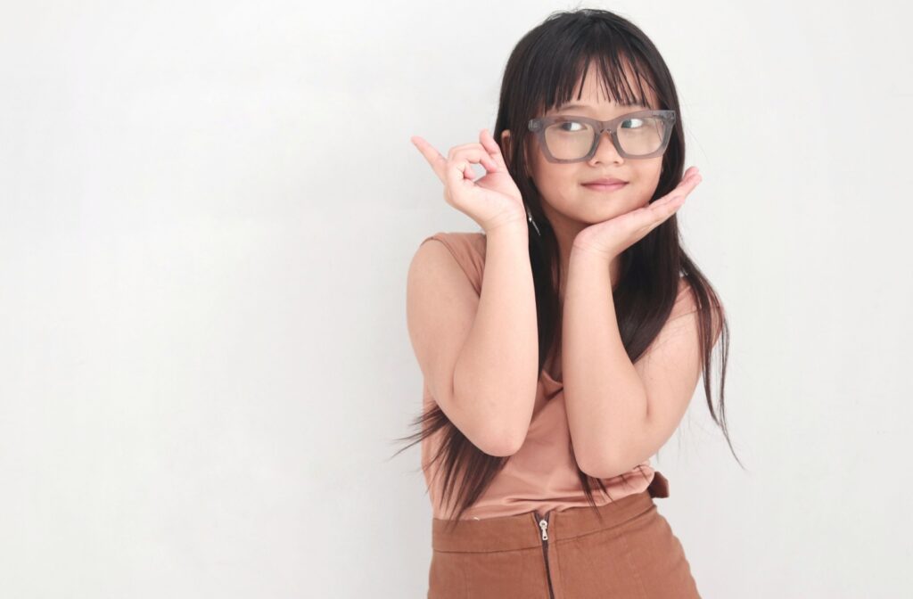 A child wearing a pair of the new myopia control glasses, Essilor Stellest lenses