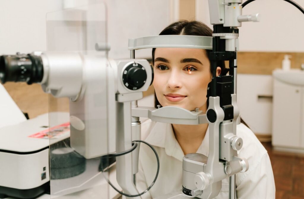 A person getting a slit lamp test done during a routine eye exam